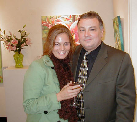 Artist: Gallery Event Photos, Title: The lovely Denise graciously poses with the gallery owner. - click for larger image