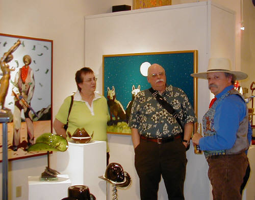 Artist: Gallery Event Photos, Title: Thom Ross talks with Collectors Mr. and Mrs. Young - click for larger image